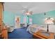 Comfortable bedroom with a plush chair, ceiling fan, and cozy lighting at 19703 Lake Lincoln Ln, Eustis, FL 32736