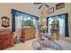 Cozy dining area with bright windows, unique décor, and comfortable seating at 19703 Lake Lincoln Ln, Eustis, FL 32736