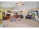 Spacious open concept living area with multiple seating areas, bar and dining spaces at 19703 Lake Lincoln Ln, Eustis, FL 32736