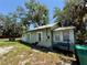 Exterior of the property showcasing the back of the home with adjacent yard space at 2001 Bates Ave, Eustis, FL 32726