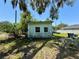 Image showcasing the rear exterior of the home and some of the surrounding yard at 2001 Bates Ave, Eustis, FL 32726