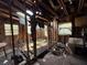 Interior shot of a heavily damaged room, revealing exposed framework and debris, indicative of significant renovation work needed at 2001 Bates Ave, Eustis, FL 32726