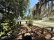 View of a residential street and yard, featuring established landscaping and neighboring houses, creating a welcoming neighborhood scene at 2001 Bates Ave, Eustis, FL 32726