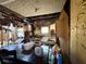 Interior of a dilapidated kitchen with damaged walls, outdated appliances, and debris at 2001 Bates Ave, Eustis, FL 32726