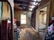 Interior of damaged room with a view of the bathroom and exposed walls and floors at 2001 Bates Ave, Eustis, FL 32726