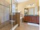 Bathroom with glass shower enclosure, separate tub, vanity with granite counter, and tile flooring at 2064 Rafton Rd, Apopka, FL 32703