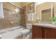 Bathroom with vanity, combined tub and shower, and tile flooring at 2064 Rafton Rd, Apopka, FL 32703