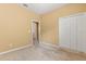 A bright bedroom with a closet and doorway visible at 2064 Rafton Rd, Apopka, FL 32703