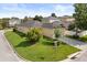 A charming one-story home with a well-manicured lawn and mature trees at 2064 Rafton Rd, Apopka, FL 32703