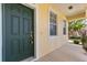 Close-up of the home's front door with a secure lock and well-lit porch, ensuring safety and convenience at 2064 Rafton Rd, Apopka, FL 32703