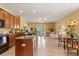 Open kitchen with granite counters, modern appliances, breakfast bar, and seamless access to living spaces at 2064 Rafton Rd, Apopka, FL 32703