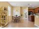 Bright kitchen area with tile flooring, a breakfast table, and convenient access to adjacent living spaces at 2064 Rafton Rd, Apopka, FL 32703