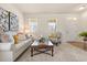 Cozy living room featuring plush seating, natural light, and a welcoming atmosphere for relaxation at 2064 Rafton Rd, Apopka, FL 32703