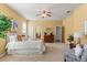 Spacious main bedroom offers neutral walls, carpet flooring, and access to walk-in closets and ensuite bathroom at 2064 Rafton Rd, Apopka, FL 32703