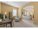 Office area with desk and chair, carpet flooring and view to the main bedroom at 2064 Rafton Rd, Apopka, FL 32703