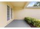 Enjoy this quaint covered patio with sliding glass doors and a small garden at 2064 Rafton Rd, Apopka, FL 32703