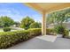 Covered porch area with lush greenery, and a tranquil ambiance to enjoy at 2064 Rafton Rd, Apopka, FL 32703