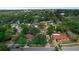 Aerial view of the neighborhood featuring mature tree coverage at 209 Edgewood Dr, Clermont, FL 34711