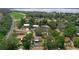 Community aerial view with lake visible in the background and tree coverage at 209 Edgewood Dr, Clermont, FL 34711