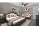 Cozy bedroom with wood flooring, ceiling fan and ample natural light at 209 Edgewood Dr, Clermont, FL 34711