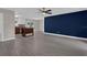Open living room featuring wood flooring, ceiling fan, natural lighting and neutral paint at 209 Edgewood Dr, Clermont, FL 34711