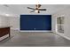 Living room featuring wood flooring, ceiling fan, natural lighting and neutral paint at 209 Edgewood Dr, Clermont, FL 34711