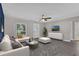 Bright living room featuring modern furniture, wood flooring and large windows at 209 Edgewood Dr, Clermont, FL 34711