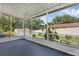 The screened-in porch overlooks the fenced-in backyard with a shed and privacy fence at 209 Edgewood Dr, Clermont, FL 34711