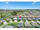Aerial view of home and neighborhood showcasing lake and golf course at 2160 Biller Cir, The Villages, FL 32163