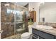 Bathroom featuring a glass-enclosed shower, decorative tile accent and modern sink vanity at 2160 Biller Cir, The Villages, FL 32163