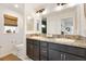 Bathroom featuring double sinks, granite countertops, and ample cabinet space at 2160 Biller Cir, The Villages, FL 32163