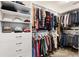 Walk-in closet with custom shelving and ample storage space for clothes, shoes, and accessories at 2160 Biller Cir, The Villages, FL 32163