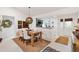 Dining room with view to kitchen and front entry, showcasing a modern design and open floor plan at 2160 Biller Cir, The Villages, FL 32163