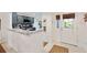 Modern kitchen with stainless steel appliances and granite countertops open to the front entry at 2160 Biller Cir, The Villages, FL 32163