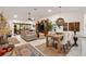 Open concept living and dining area with stylish decor and modern light fixtures at 2160 Biller Cir, The Villages, FL 32163
