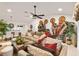 Large living room with vaulted ceilings, comfortable seating, and easy access to the dining area at 2160 Biller Cir, The Villages, FL 32163