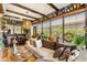Inviting living room featuring stylish decor, comfortable seating, and sunny windows at 2160 Biller Cir, The Villages, FL 32163