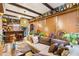 Sunroom living room with a cozy couch, decorative plants, a bar and decorative wine collection on display at 2160 Biller Cir, The Villages, FL 32163