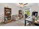 Cozy office with a large desk, comfortable seating, and natural light streaming in from the window at 2160 Biller Cir, The Villages, FL 32163
