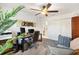 An office featuring a dual-monitor setup, comfortable seating, and ample storage space at 2160 Biller Cir, The Villages, FL 32163