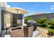 Outdoor patio area with furniture, grill and landscaping at 2160 Biller Cir, The Villages, FL 32163