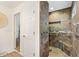 Tiled walk-in shower with built-in bench, providing a luxurious spa-like experience at 2160 Biller Cir, The Villages, FL 32163