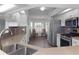 Bright kitchen with stainless steel appliances, updated countertops, and breakfast nook with plantation shutters at 21926 King Alfred St, Leesburg, FL 34748