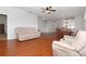 Spacious living and dining area with hardwood floors and lots of natural light, perfect for entertaining at 21926 King Alfred St, Leesburg, FL 34748