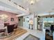 Open dining area with views to the kitchen and living room at 2415 Twickingham Ct, Clermont, FL 34711