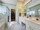 Main bathroom with double sinks, shower, walk-in closet, and tiled floors at 2415 Twickingham Ct, Clermont, FL 34711