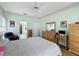 Comfortable main bedroom with hard wood floors, a ceiling fan, and a neutral color scheme at 2415 Twickingham Ct, Clermont, FL 34711