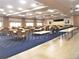 Large meeting space with tables, chairs, and a carpeted area in the center at 2415 Twickingham Ct, Clermont, FL 34711