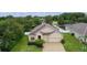 Stunning aerial view of the property with a spacious layout and scenic surroundings at 2424 Plumadore Dr, Grand Island, FL 32735