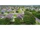 Lush aerial view of a neighborhood featuring many homes at 2424 Plumadore Dr, Grand Island, FL 32735